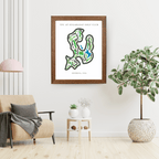 Framed map of a golf course on a wall in a living room with decor elements.