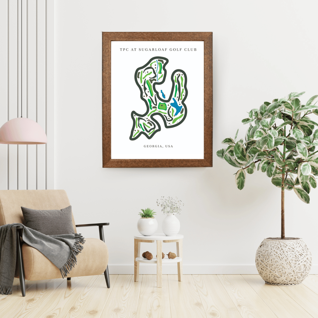 Framed map of a golf course on a wall in a living room with decor elements.