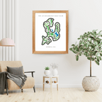 Framed golf course map on a wall in a living room with decor elements.