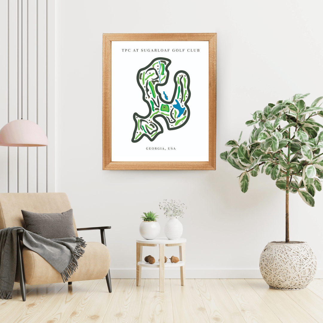 Framed golf course map on a wall in a living room with decor elements.